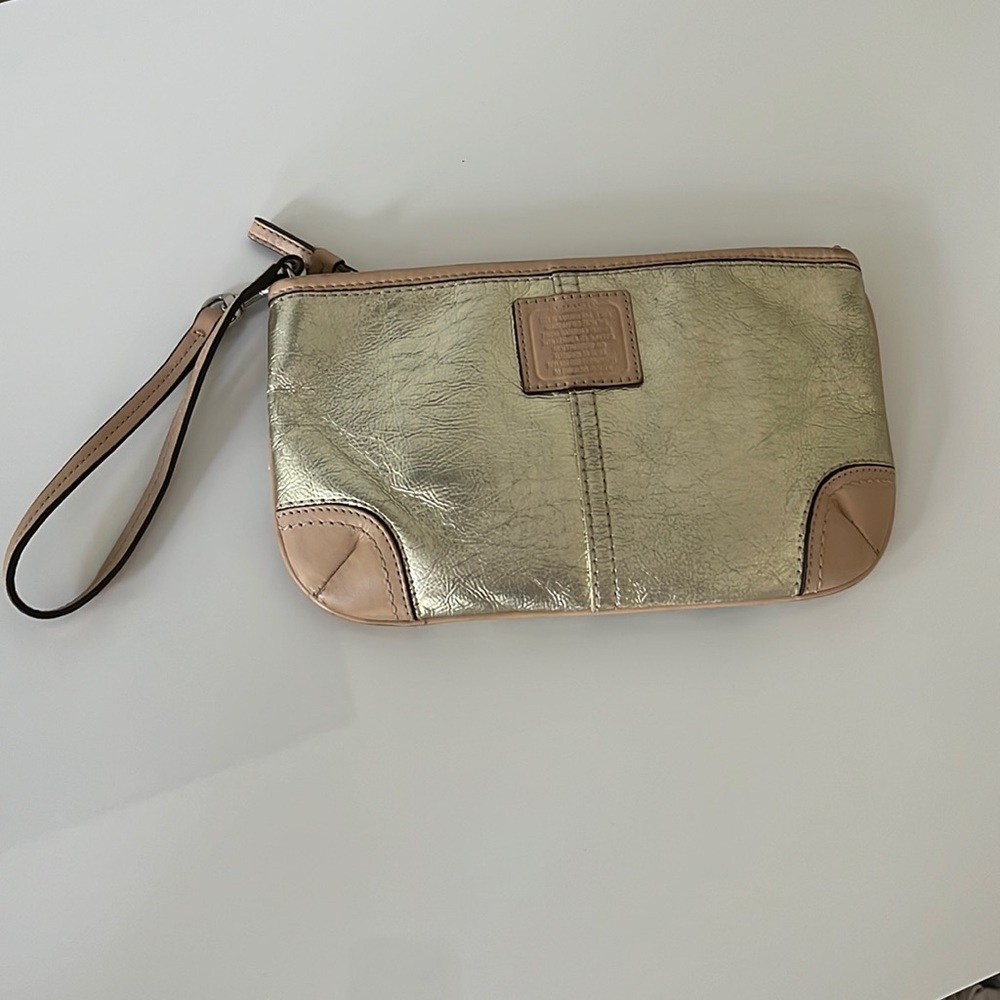 COACH metallic gold wristlet